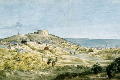 An illustration of Fremantle depicting the Round House, the ocean, and a number of small dwellings and trees scattered over the grassy hills