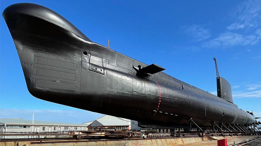 An image of the HMAS Ovens Submarine showing a freshly painted submarine after undergoing conservation