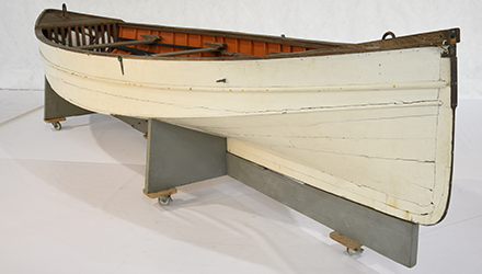 Makmoom is a wooden open boat, known as a jukong, from the Cocos (Keeling) Islands. Based off a whale boat design, it is a double-ended, carvel planked vessel with a single chine hull. The rudder is mounted to the stern and steered with two ropes. The deck and thwarts are varnished. The aft (rear) thwart serves as a mast partner for the mast, which holds the mainsail, jib and boom.