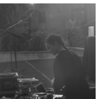 a person is operating dj equipment outdoors 