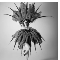 a person holds large feathers above their head and across their body