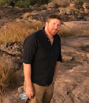 Man in black shirt on a rock