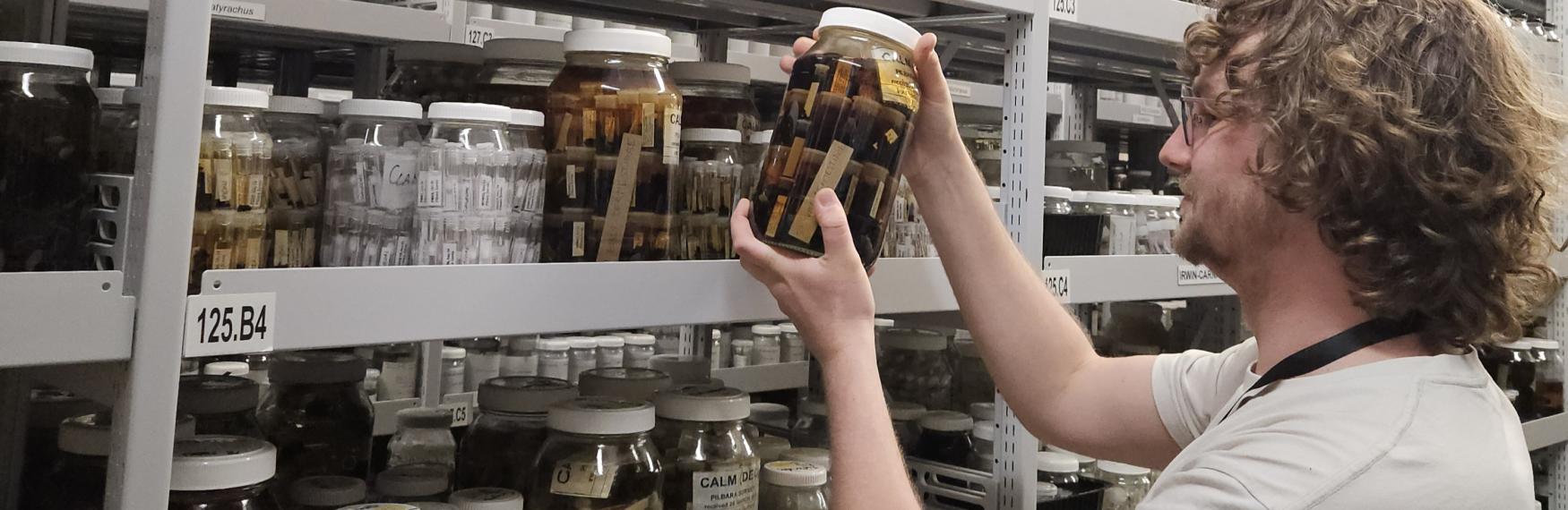 Project Officer Tom Ferguson with WA Museum collection