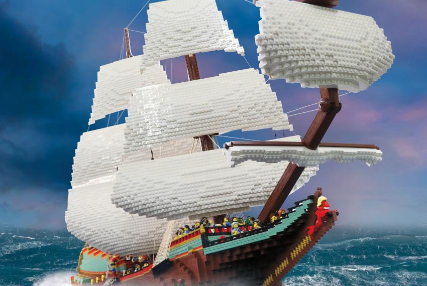 A poster featuring a LEGO ship sailing on the ocean