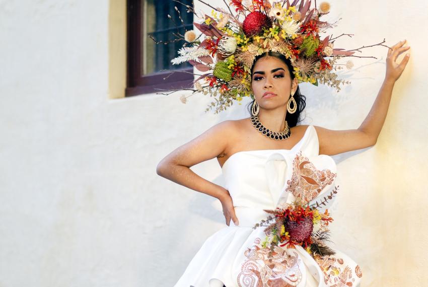 Model Ivyana Vinci wears the dress created by local artists Karen Elizabeth Young, seamstress Jasmine Ng and Aboriginal artist Sammy Wyborn