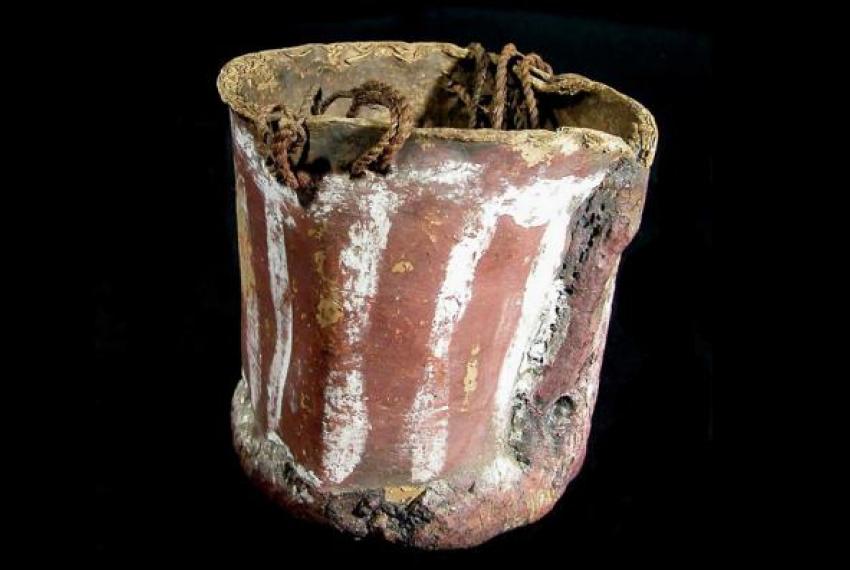 A bark bucket on a black background