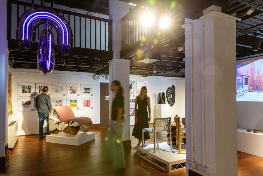 People walking through an architecture exhibition 