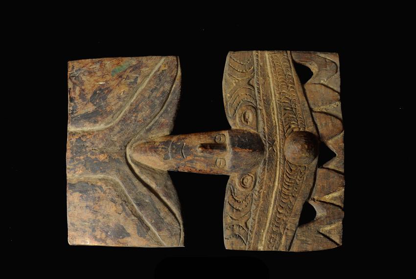 Traditional wooden tribal carving, a Hard wood plaque from the Middle Sepik region, with symmetrical design.