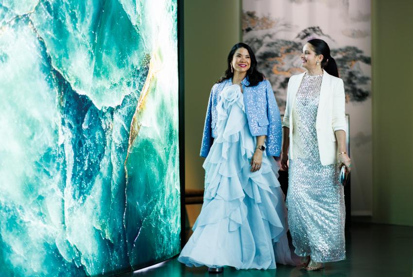 2 people wearing beautiful blue dresses 