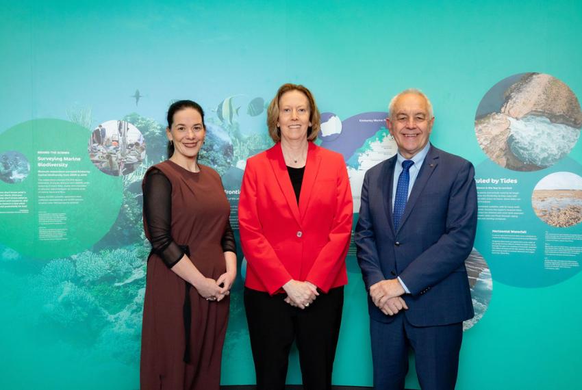 Coralie Bishop, Meg O'Neil and Alec Coles in front of the a marine wall