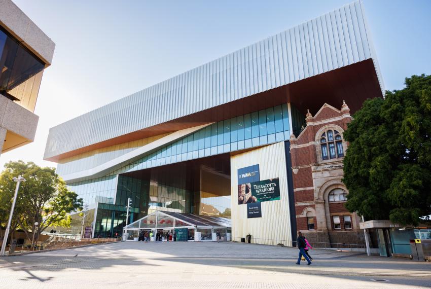 The large front entrance of the WA Museum Boola Bardip City Room taken from afar on a clear day.