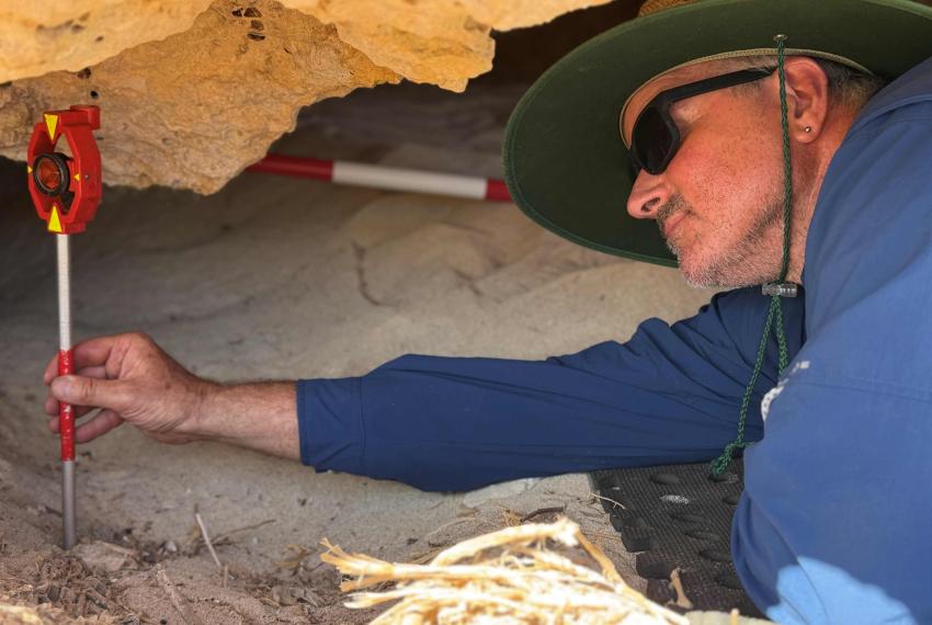 Ross Anderson surveying inside the cave