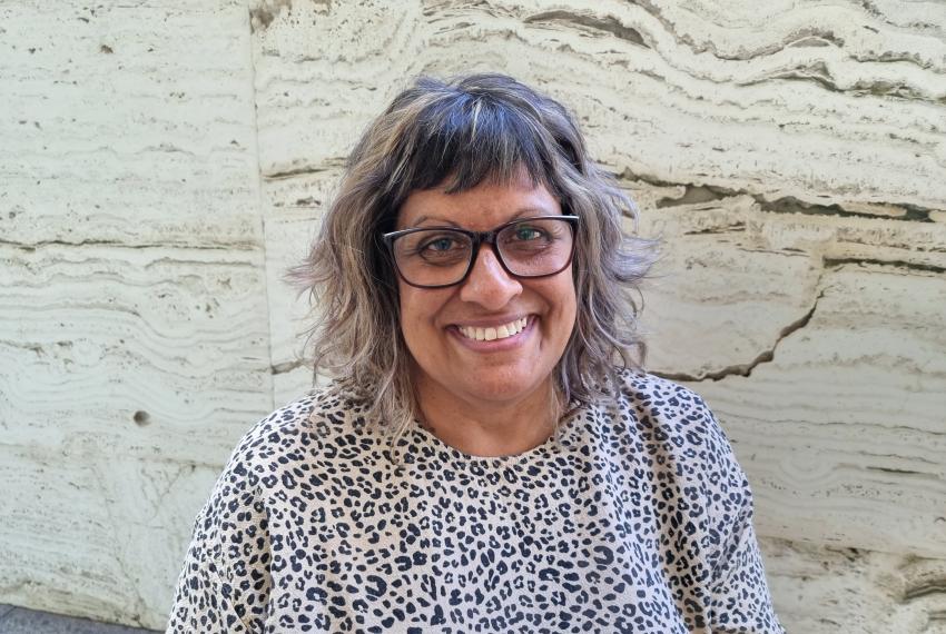 A portrait of Leanne smiling at the camera.
