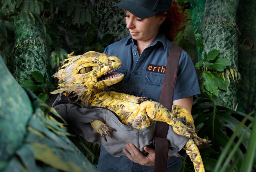 Baby Australovenator puppet with handler