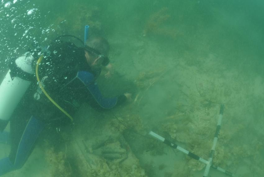 Western Australian Museum Maritime Archaeologist Michael ‘Mack’ McCarthy inspecting the wreck underwater at 7 Mile Beach