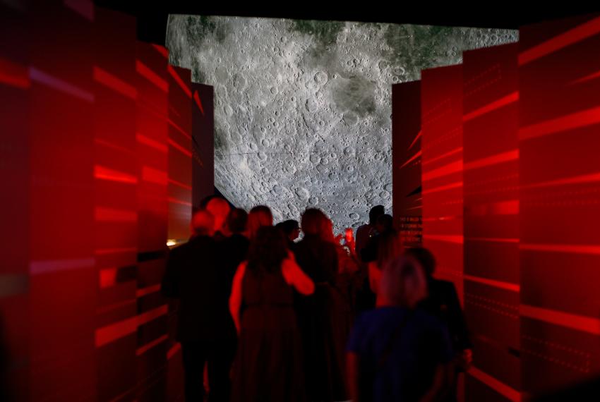 Visitors look at Museum of the Moon part of To the Moon at WA Museum Boola Bardip