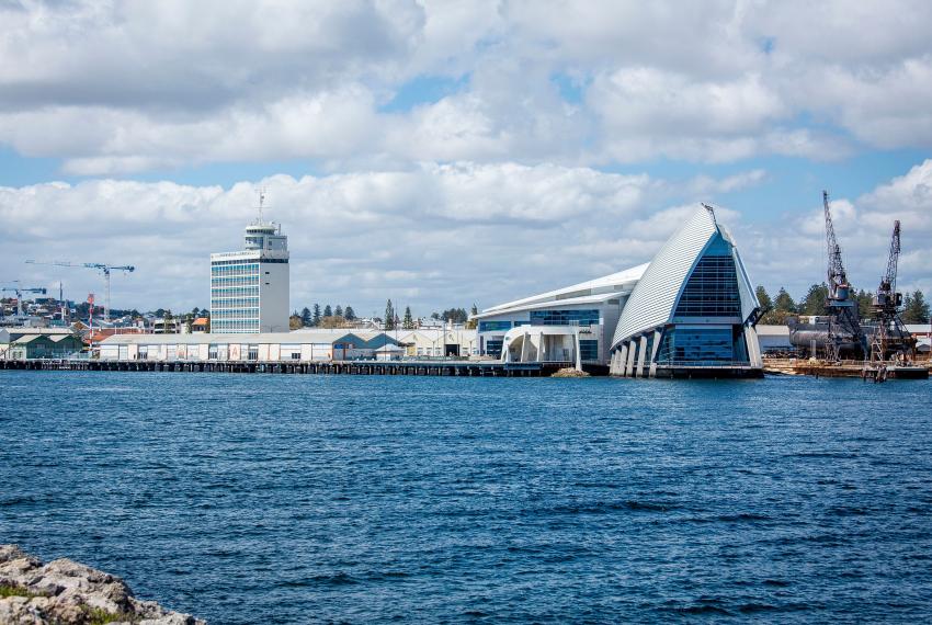 Exterior photo of WA Maritime Museum from across the port looking back at the museum.