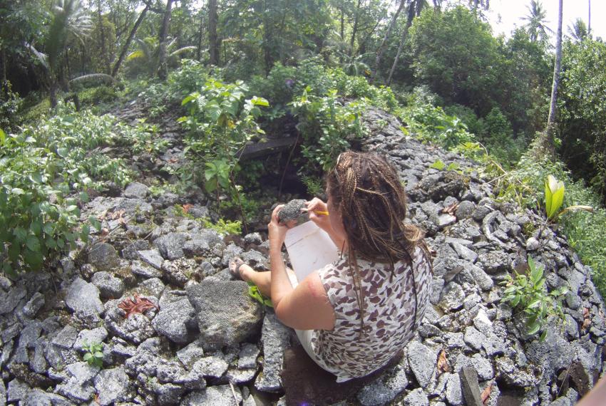 WA Museum's Dr Zoe Richards examining corals at one of the ancient Leluh tombs