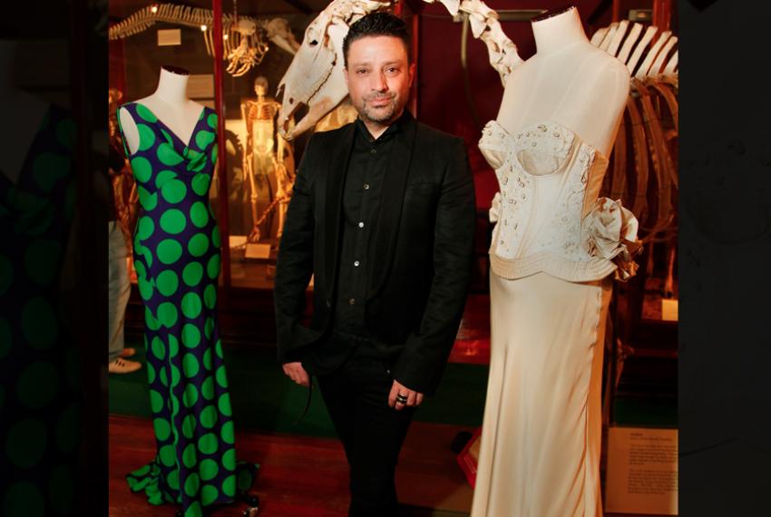 Aurelio Costarella standing next to two of his designs