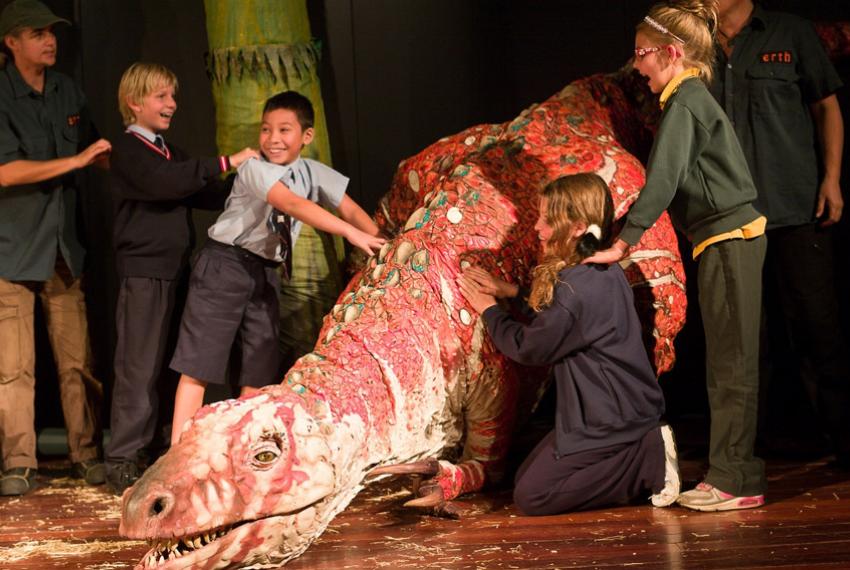 Children participating in the Erth Dinosaur Petting Zoo performance