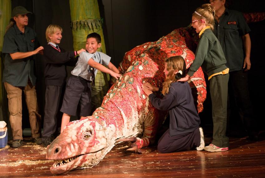 Students get up close to the Australovenator during a Dinosaur Petting Zoo performance at the WA Museum – Perth