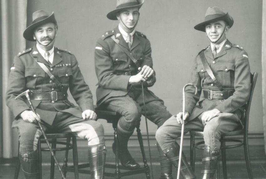 Three World War One soliders posing for a photo