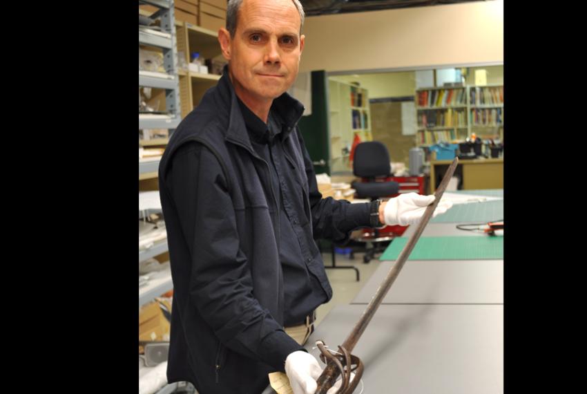 Stephen Anstey holding a sword
