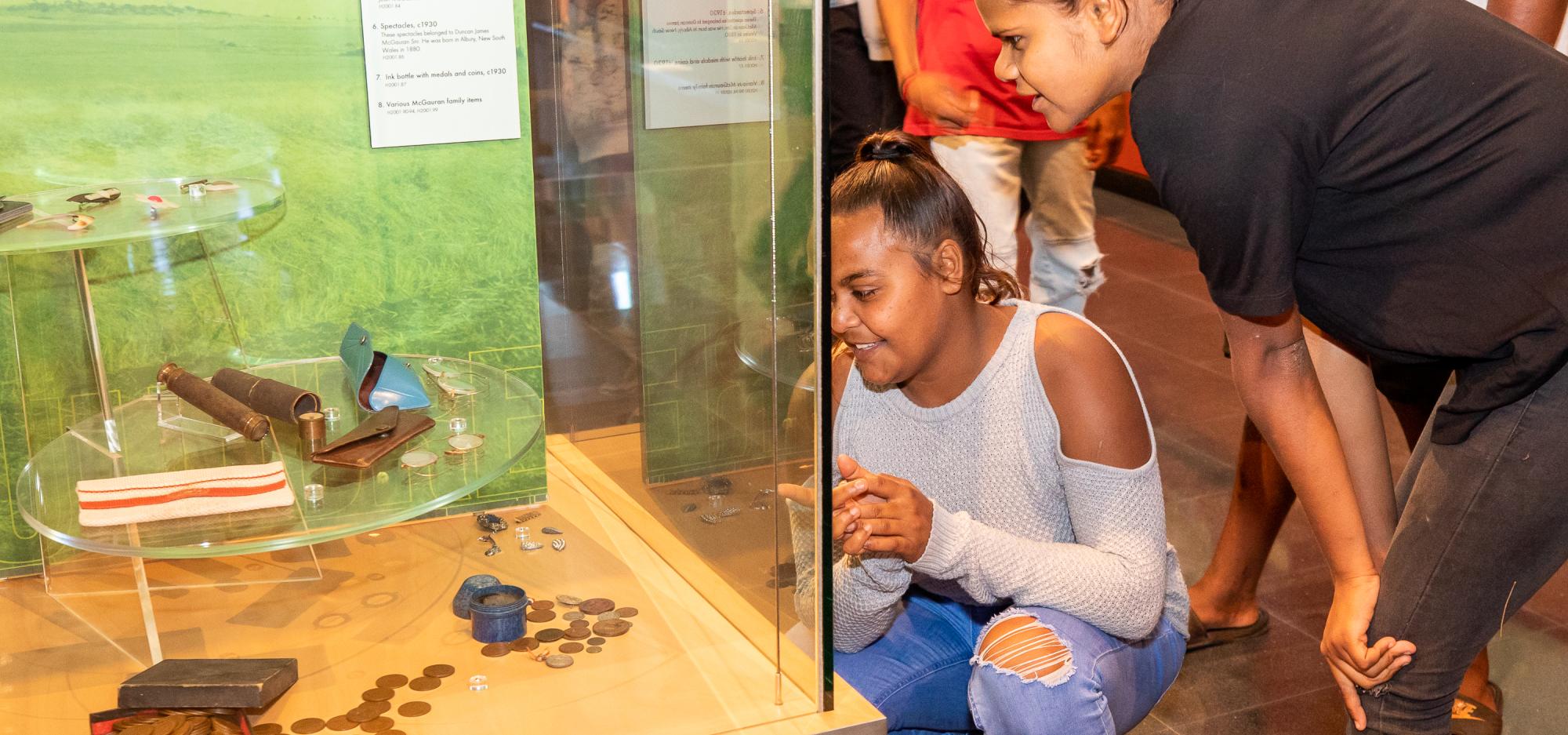 Two people look at a showcase in the Museum of Geraldton