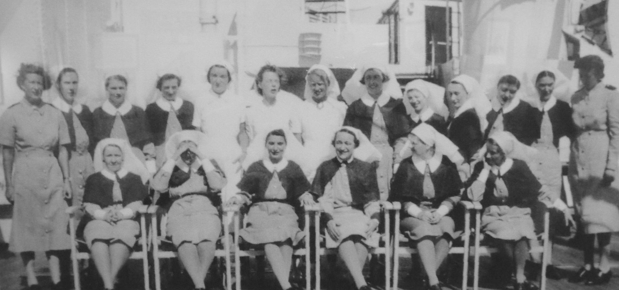 A black and white group photograph from the 1940s of nurses in uniform