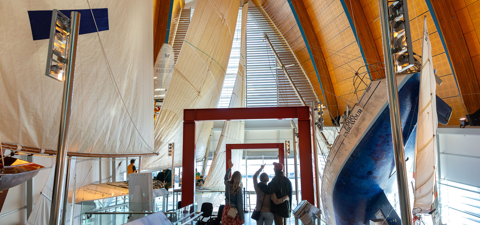 A family stand on the walkway at the WA Maritime Museum