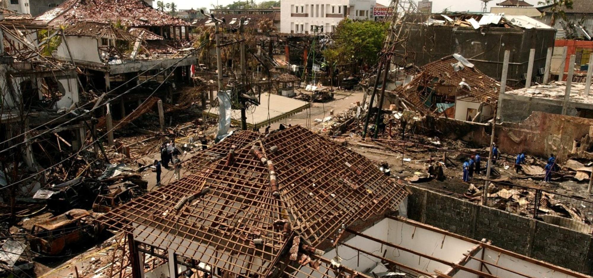 A street scene where buildings have been destroyed by a bomb