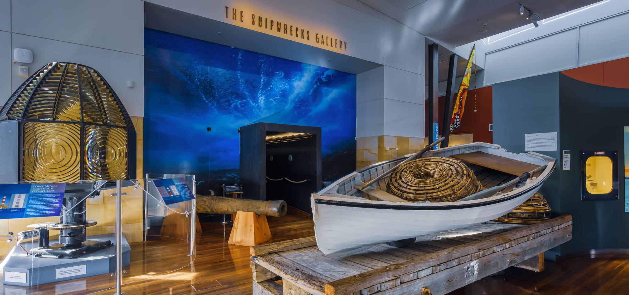 A museum gallery displaying various boating related objects