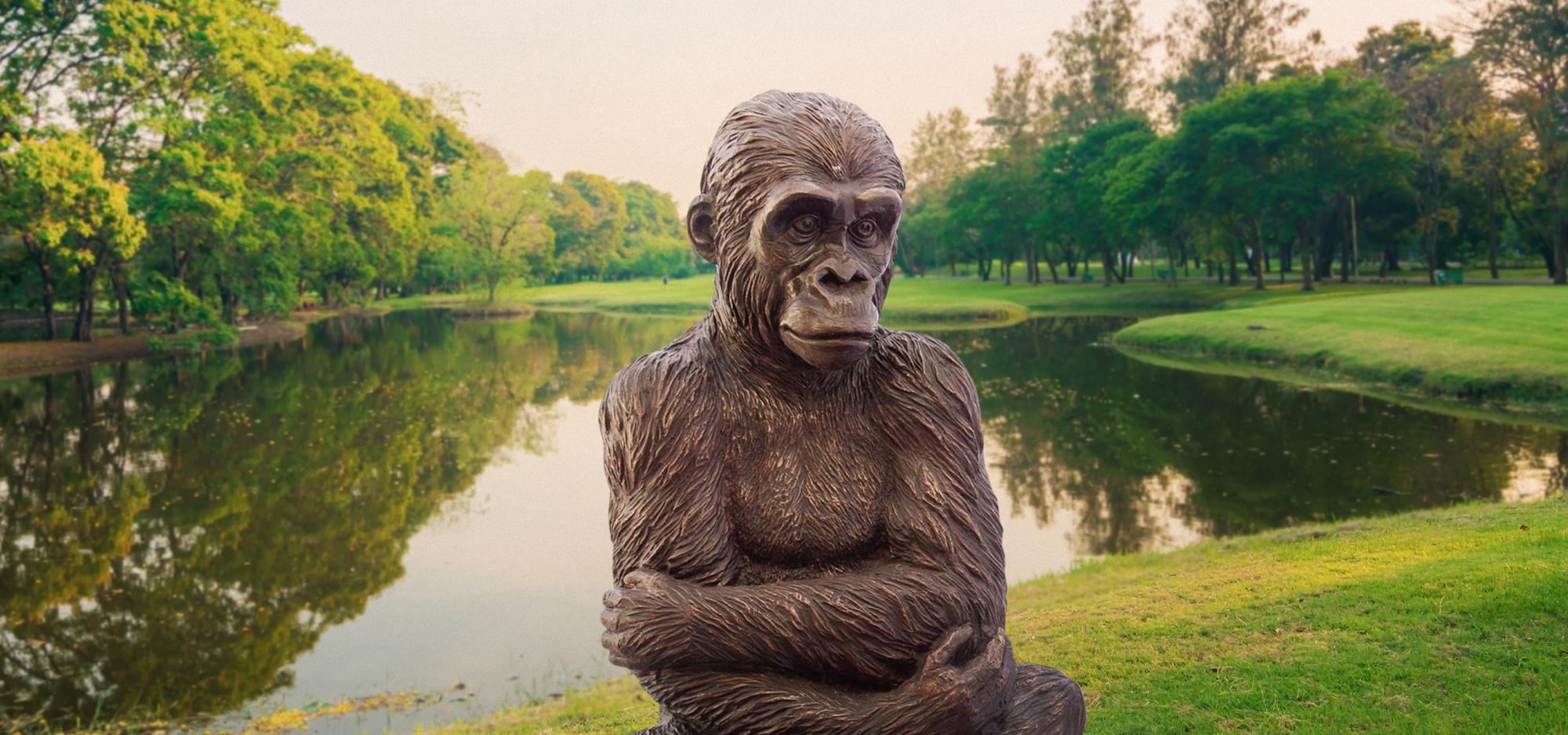  Wild Baby Western Lowland Gorilla statue on a green field