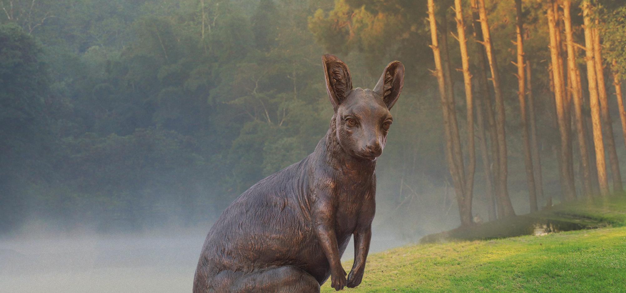 Wild Baby Rock Wallaby statue on a green field