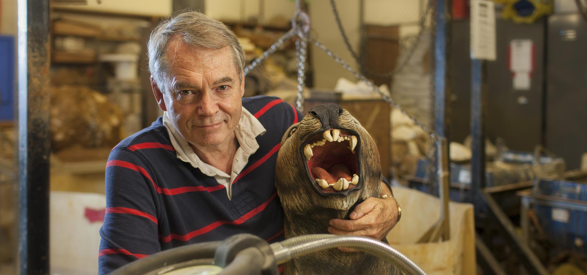 This image shows the paleontologist Mike Archer working in his lab. 