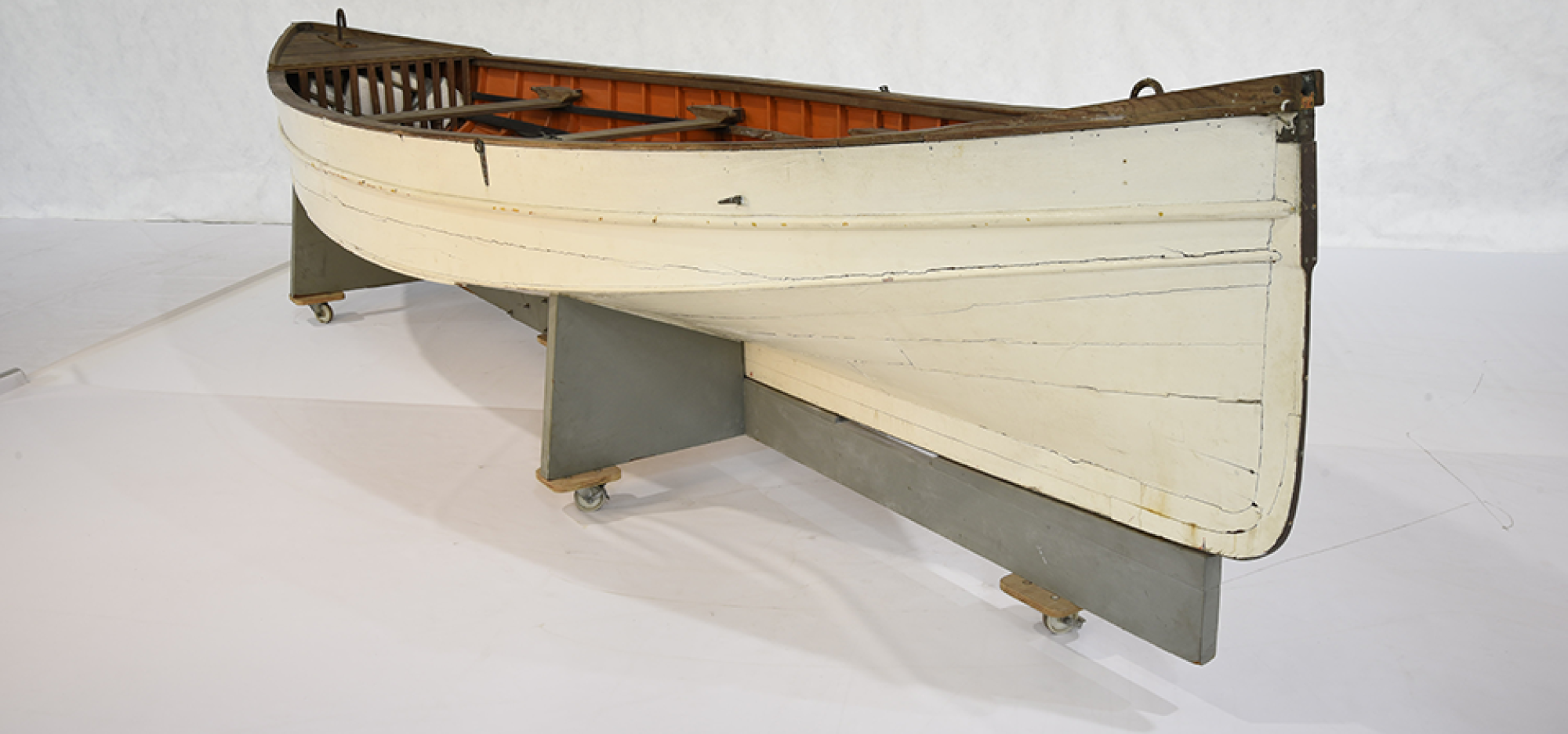 Makmoom is a wooden open boat, known as a jukong, from the Cocos (Keeling) Islands. Based off a whale boat design, it is a double-ended, carvel planked vessel with a single chine hull. The rudder is mounted to the stern and steered with two ropes. The deck and thwarts are varnished. The aft (rear) thwart serves as a mast partner for the mast, which holds the mainsail, jib and boom. 