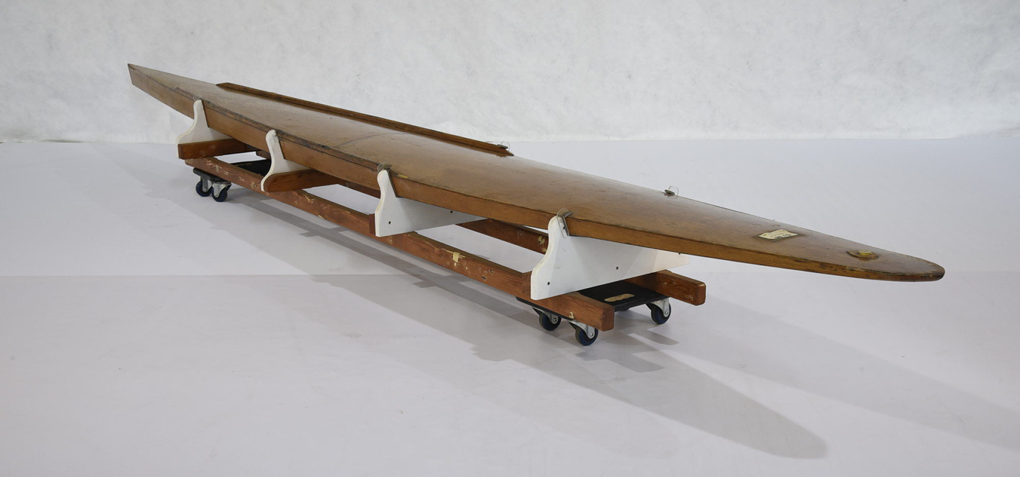 Toothpick boards are constructed of a timber frame, clad in varnished wood (such as plywood or balsa) sheets that are fixed using adhesive. This makes the board hollow, providing buoyancy. There is a removeable plug in the deck at the nose of the board to drain water after each use.  The board features a shallow continuous rocker. This is the gently curved base of the board, running from the thin, rounded nose to the sharply pointed tail. The deck from aft of the nose to the tail is slightly domed.