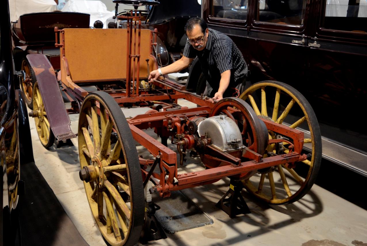 Western Australian Museum Technical Officer Salvador Gomez examining the car