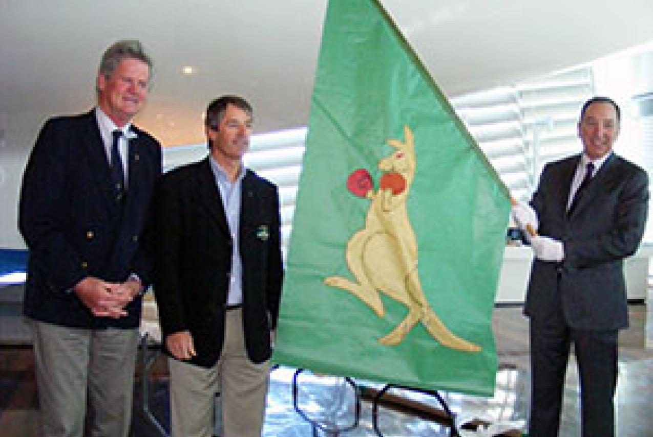 Left to Right: Former Australia II crewmen John Longley and Skip Lissiman present the Boxing Kangaroo flag to Tim Ungar, Chair of the Board of Trustees of the WA Museum.