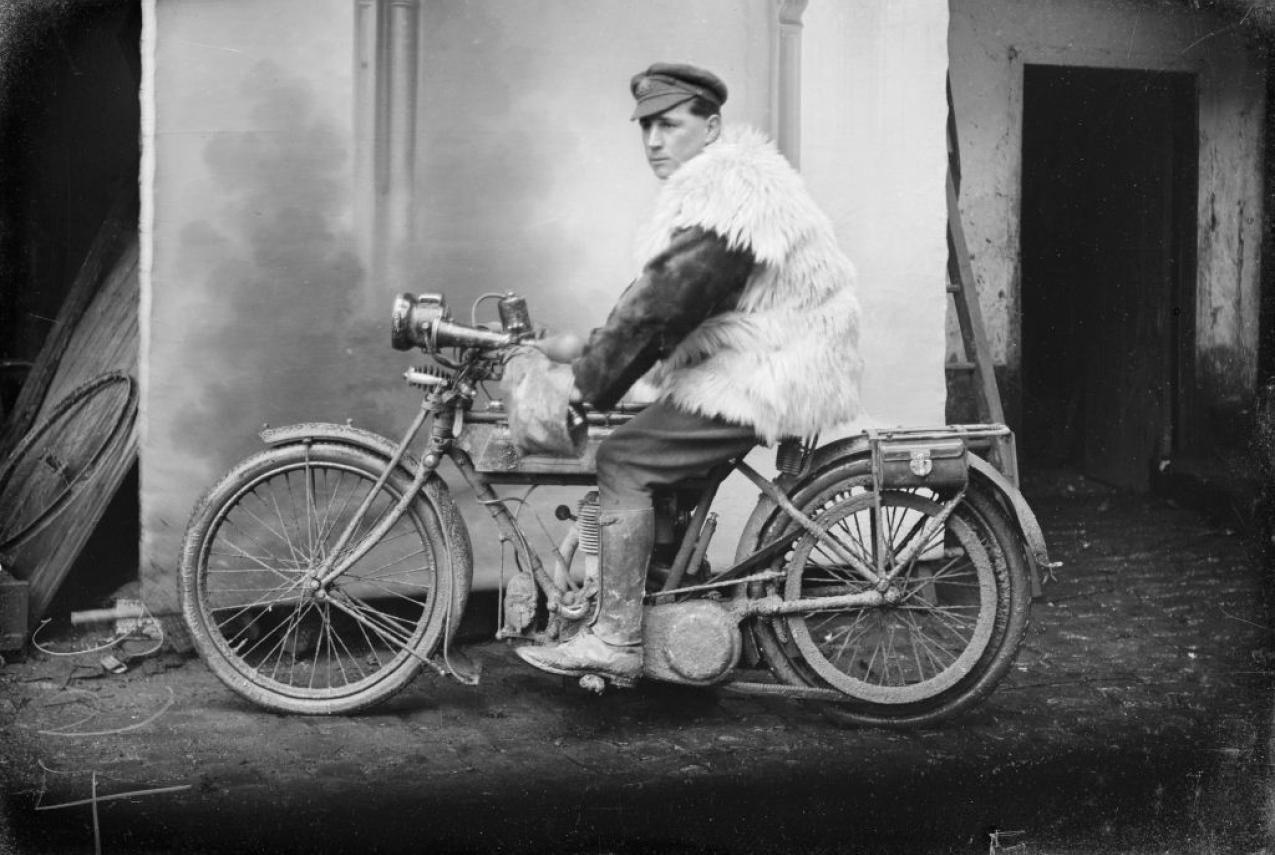 Corporal James Davie Renner, 4th Divisional Signals Company, of Fremantle, Western Australia sitting on a motorbike