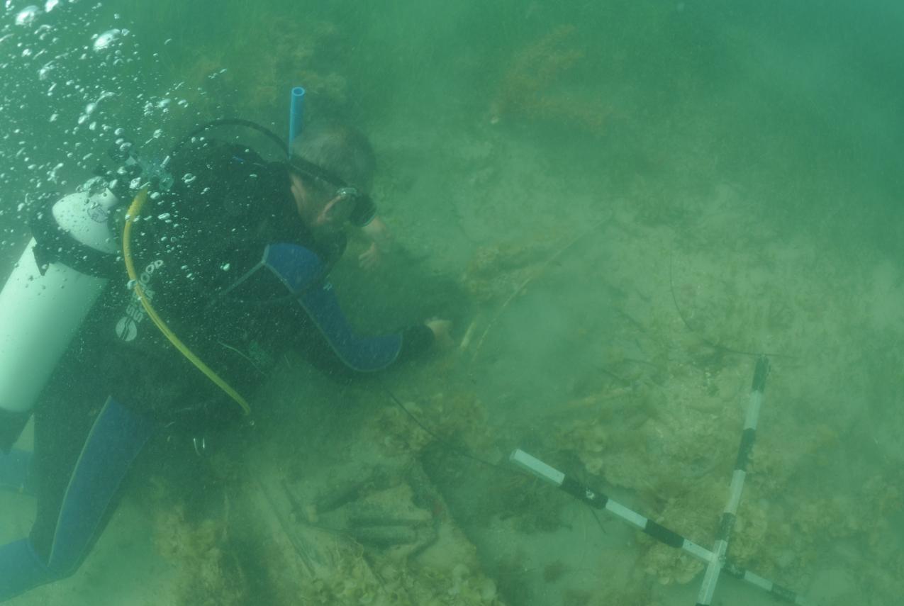 Western Australian Museum Maritime Archaeologist Michael ‘Mack’ McCarthy underwater, inspecting the wreck at 7 Mile Beach