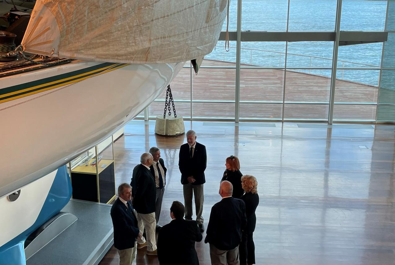 Eileen Bond and crew members take a sneak peek during filming for the new Australia II: 40 Years On exhibition film.