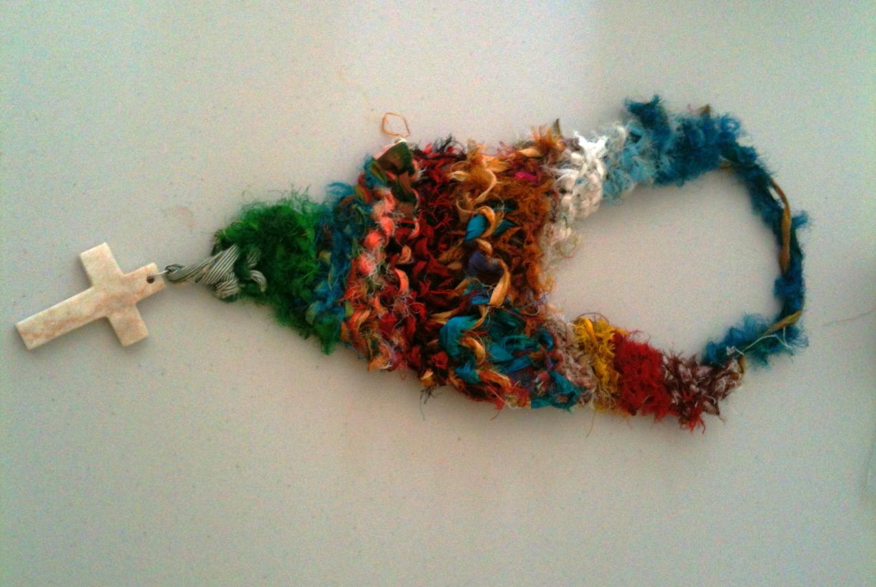 A piece of handmade jewellery on a white table