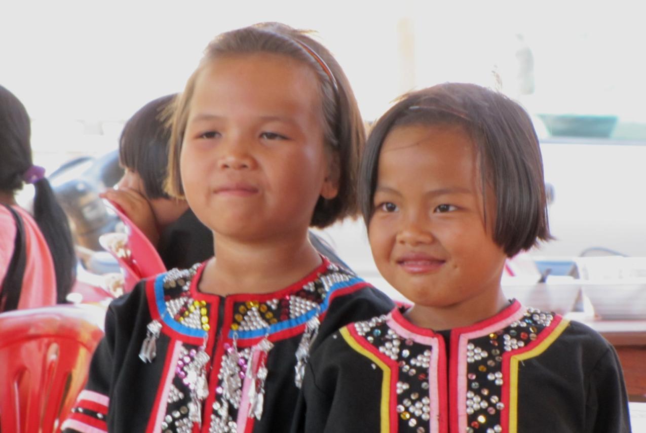 Two girls wearing traditional Thai Hill Tribe clothing