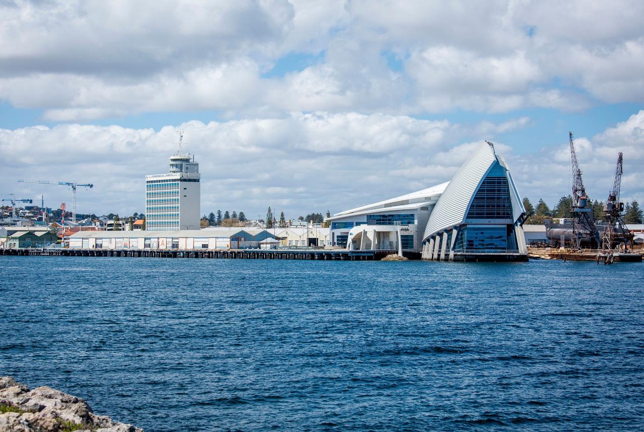 Exterior photo of WA Maritime Museum from across the port looking back at the museum.