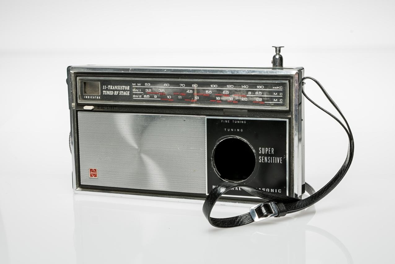 A silver and black radio adapted to conceal a camera, c1965.