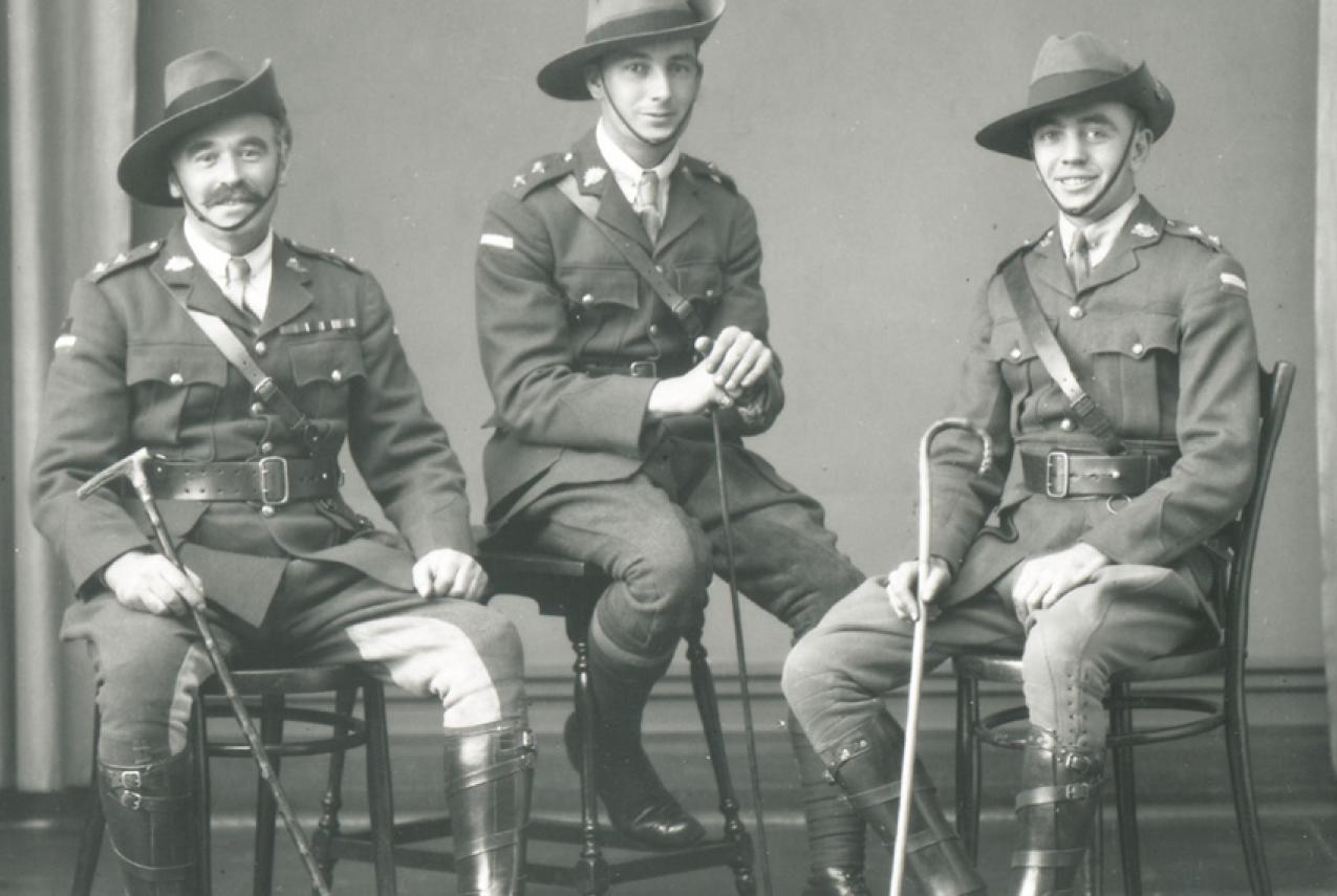 Three World War One soliders posing for a photo