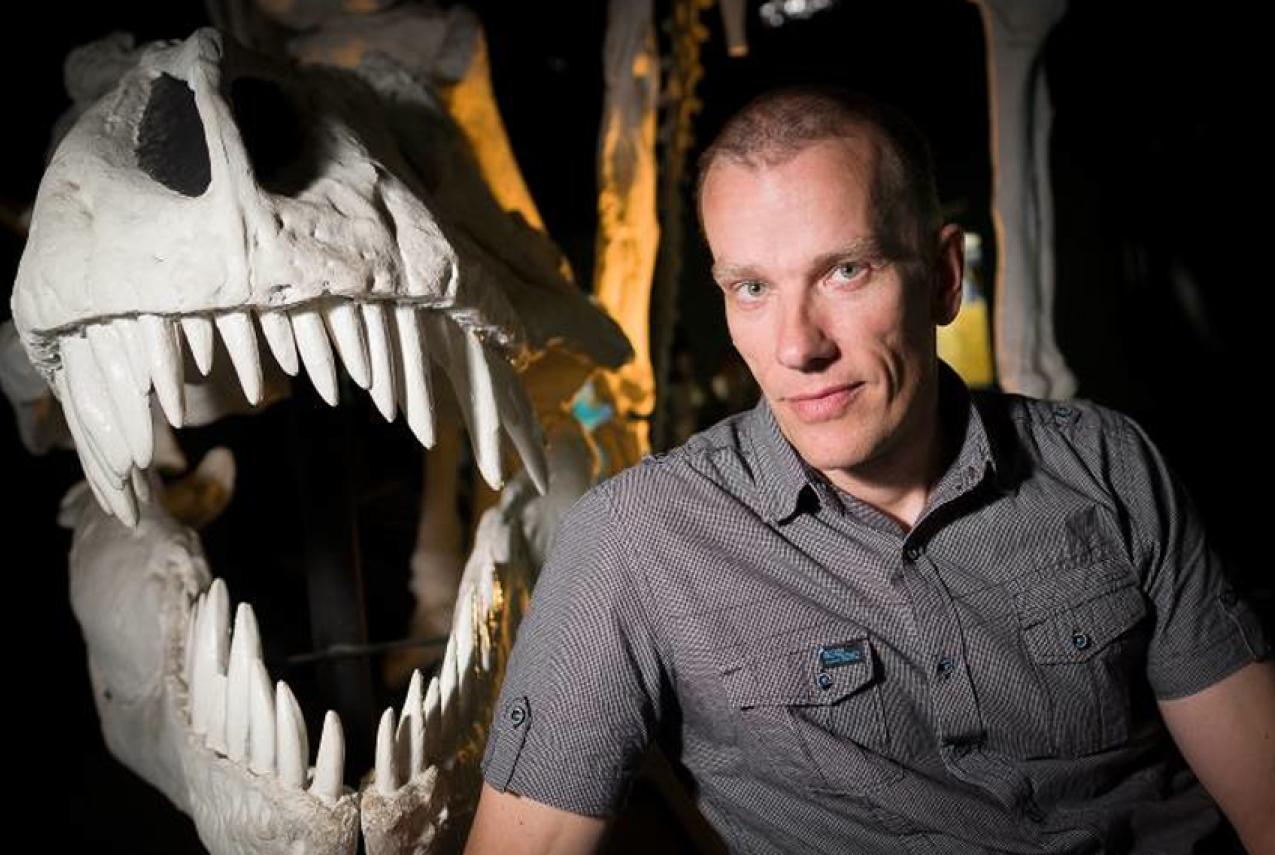 Dr Mikael Siversson, Western Australian Museum Curator of Palaeontology, next to a cast of a Tyrannosaurus rex