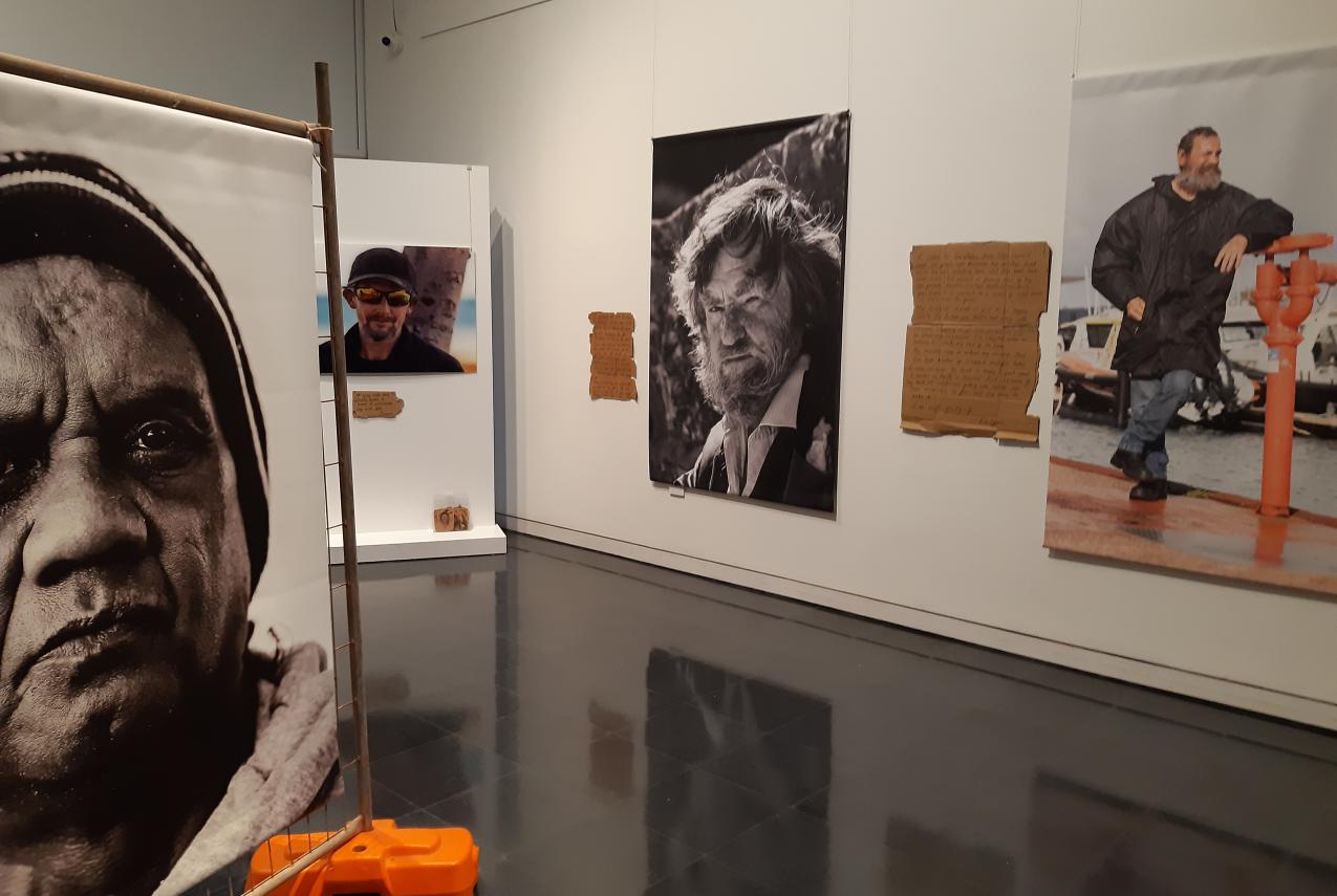 Portrait images in exhibition gallery