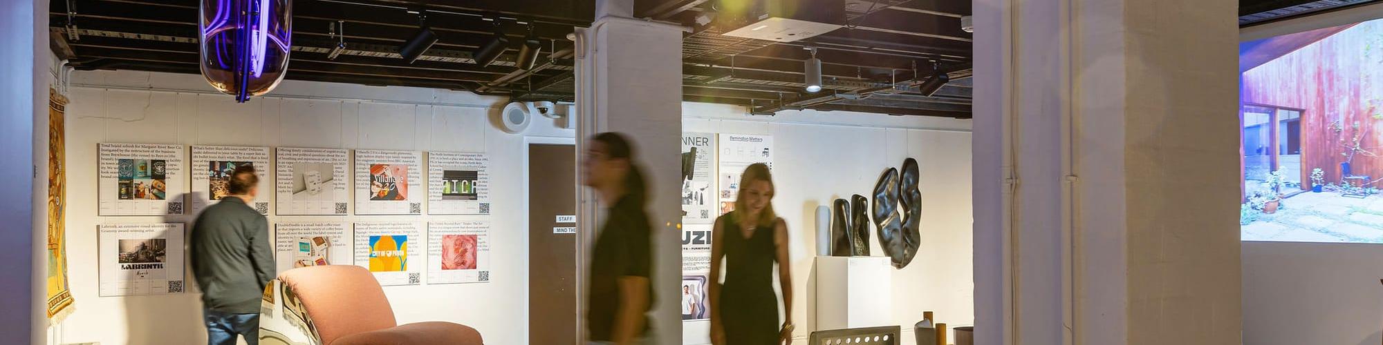 People walking through an architecture exhibition 